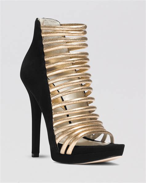 michael kors gold heel black shoe|Michael Kors boots gold heel.